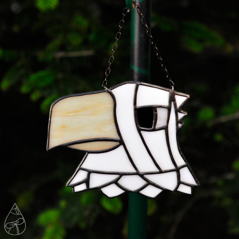 A stained glass suncatcher of Apollo from the game Animal Crossing.